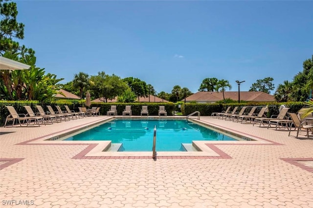 view of swimming pool featuring a patio