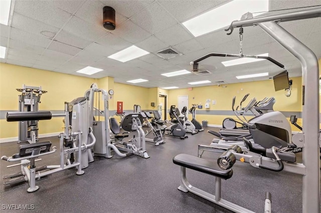 workout area featuring a paneled ceiling