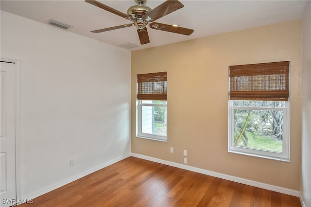 unfurnished room featuring ceiling fan and hardwood / wood-style flooring