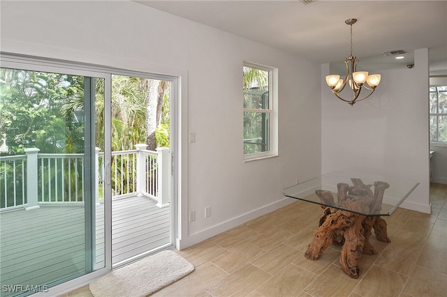 dining space featuring a chandelier