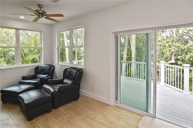 living area with ceiling fan