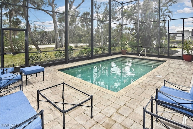 view of pool with a lanai and a patio