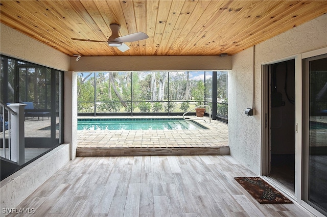 view of pool featuring ceiling fan