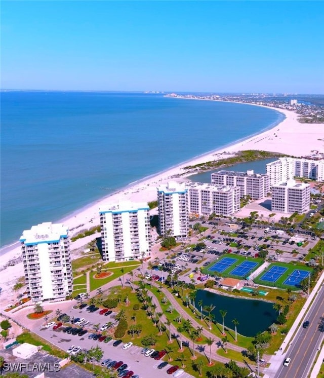 aerial view with a water view and a view of the beach