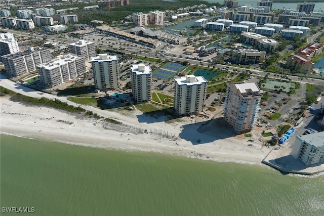 bird's eye view featuring a view of the beach and a water view