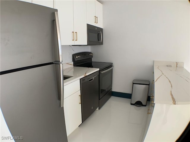 kitchen with white cabinets and black appliances