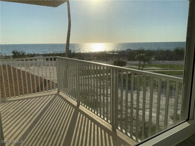 balcony featuring a water view