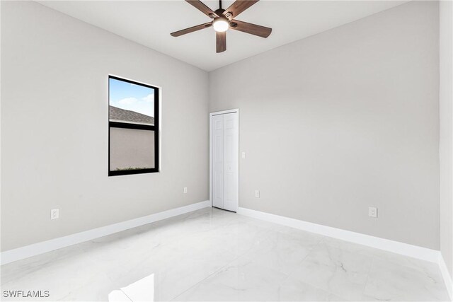 spare room featuring ceiling fan