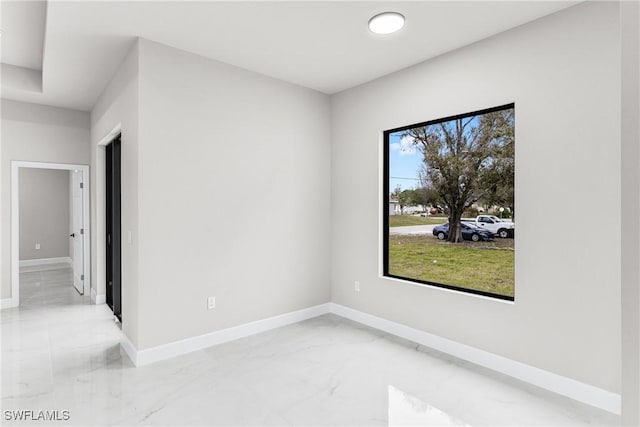 unfurnished room featuring plenty of natural light