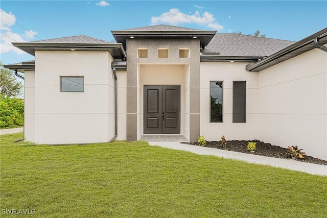 rear view of house with a lawn