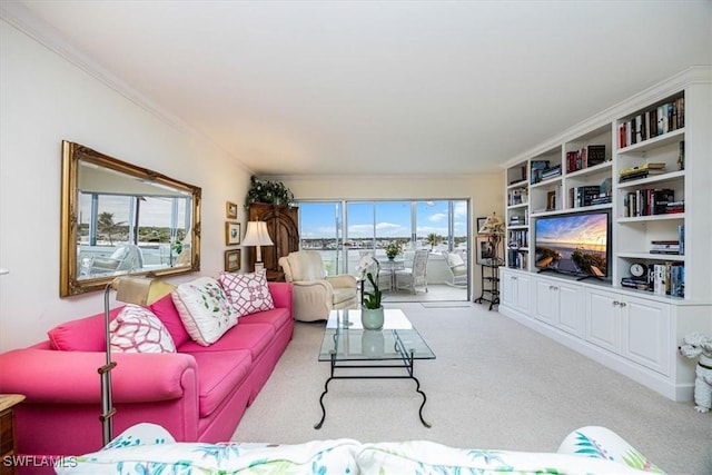 living room with light carpet and ornamental molding