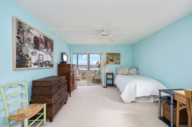 carpeted bedroom featuring access to exterior and ceiling fan