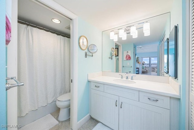 full bathroom with vanity, toilet, and shower / bath combo with shower curtain