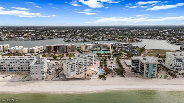 aerial view featuring a water view and a beach view