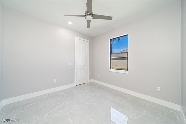 unfurnished room featuring ceiling fan