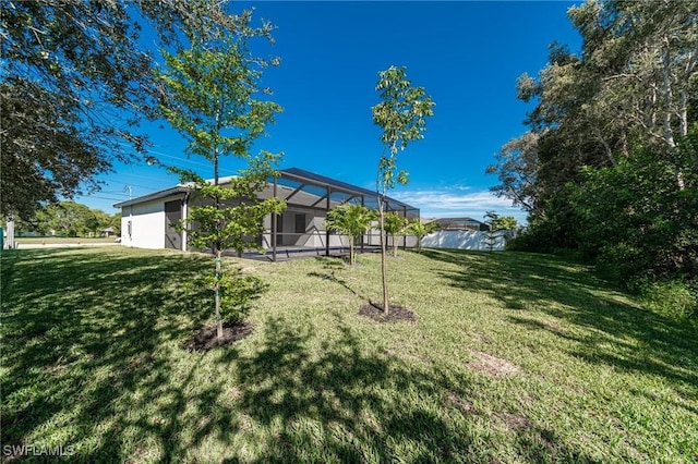 view of yard featuring glass enclosure