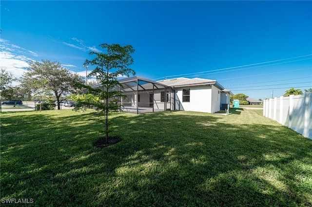 view of yard featuring a lanai