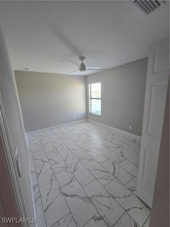 unfurnished room with ceiling fan