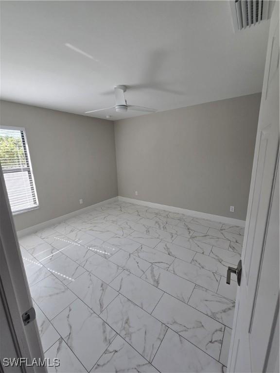 unfurnished room featuring ceiling fan