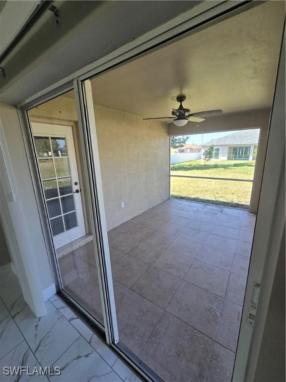 view of patio / terrace featuring ceiling fan