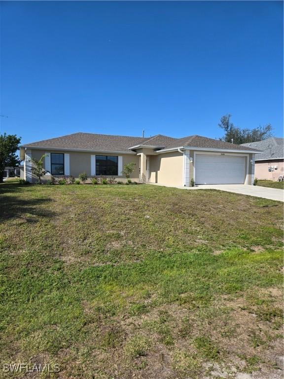 single story home featuring a front yard and a garage