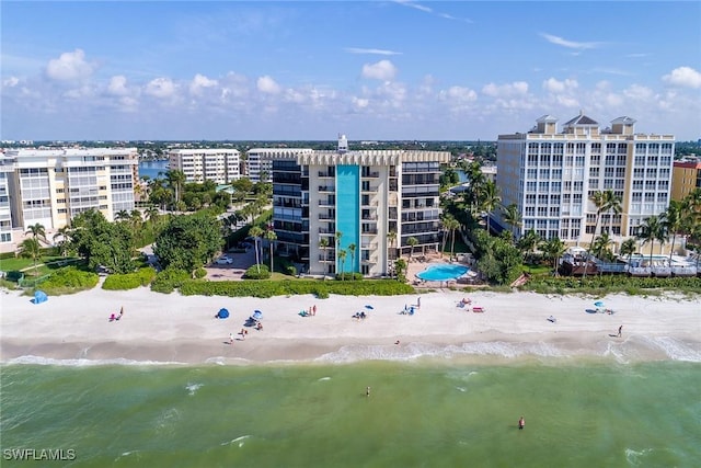 view of property featuring a view of the beach and a water view