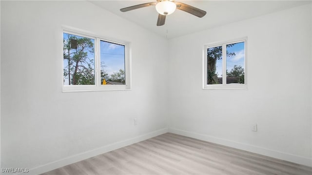 spare room featuring ceiling fan and light wood-type flooring