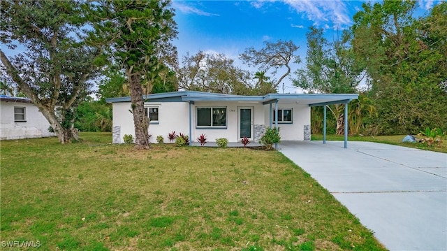 single story home with a front yard and a carport