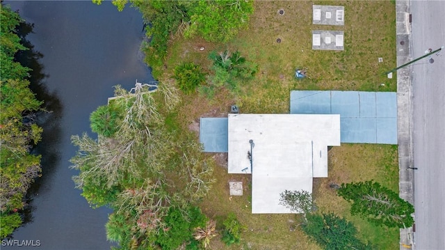 birds eye view of property with a water view