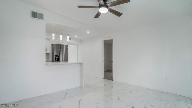 unfurnished room featuring ceiling fan