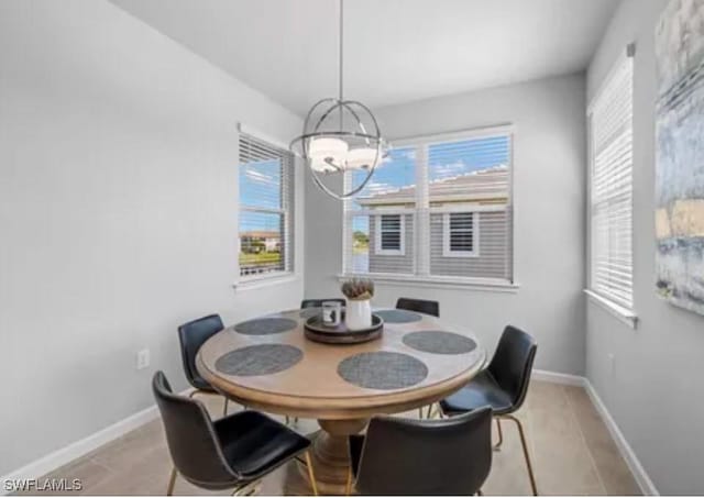 dining area featuring an inviting chandelier