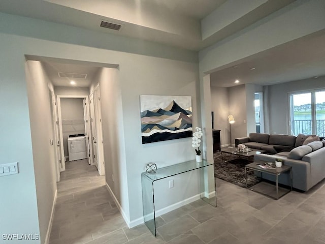 hallway with washer / dryer