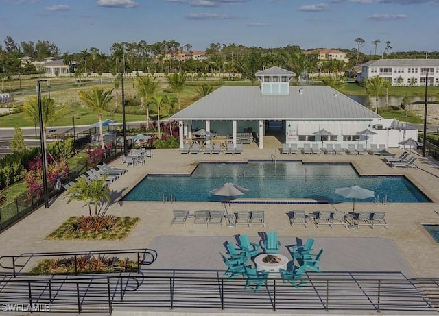 view of swimming pool with a patio