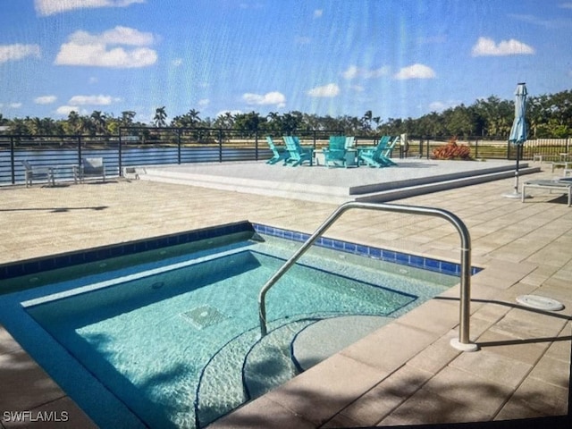 view of swimming pool with a patio area