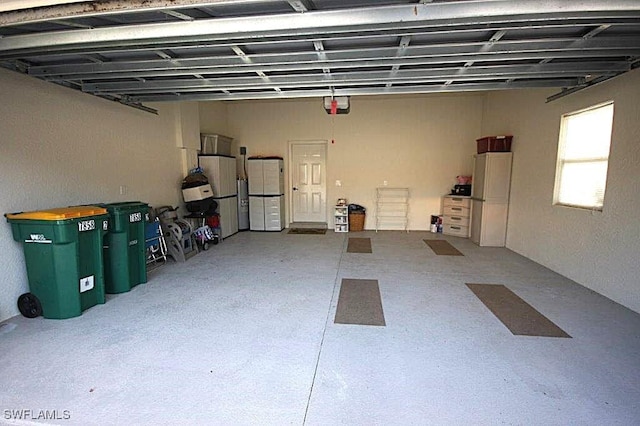 garage featuring a garage door opener