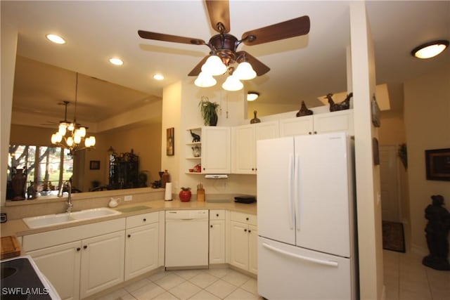 kitchen featuring white cabinetry, sink, light tile patterned floors, kitchen peninsula, and white appliances