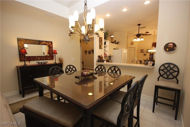 dining area featuring ceiling fan and light tile patterned flooring