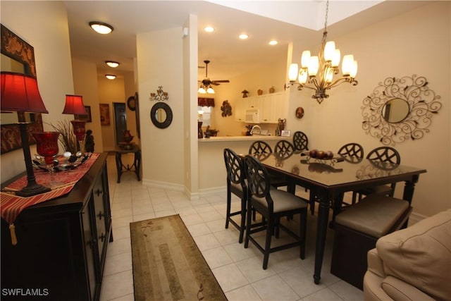 dining area featuring light tile patterned floors and ceiling fan