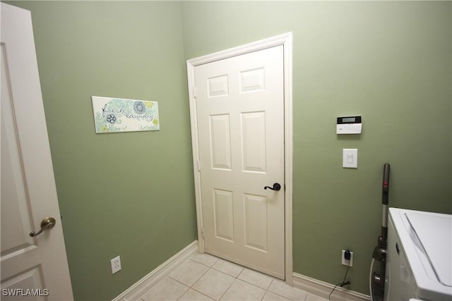 laundry area featuring light tile patterned floors