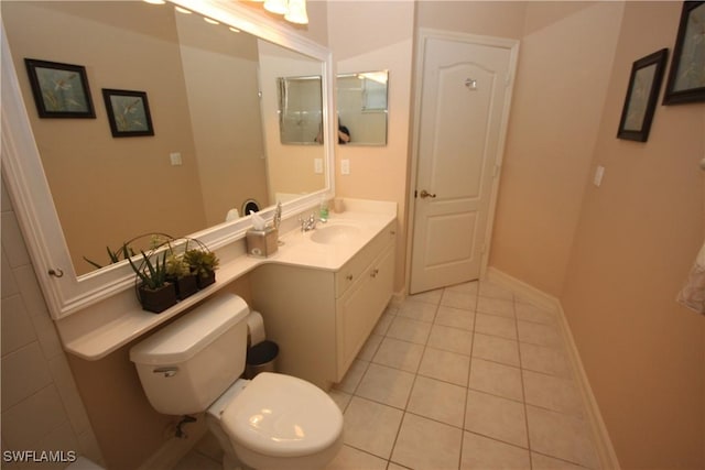 bathroom with tile patterned floors, toilet, and vanity