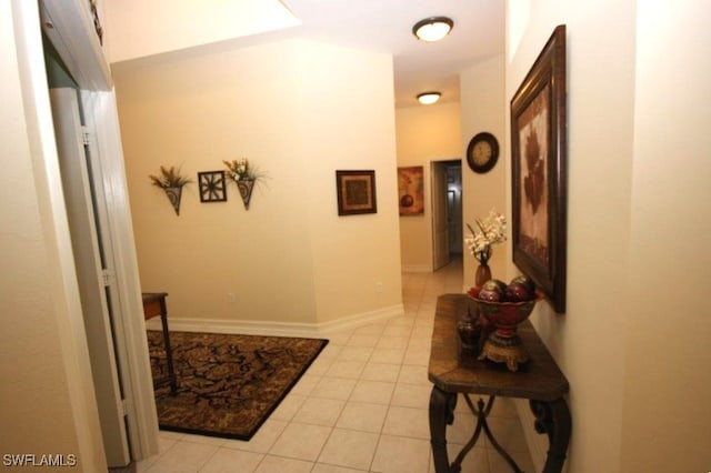 corridor with light tile patterned flooring