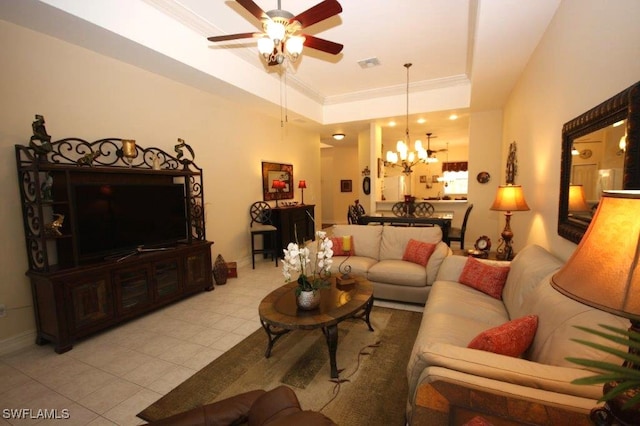 living room featuring a raised ceiling, crown molding, ceiling fan with notable chandelier, and light tile patterned floors