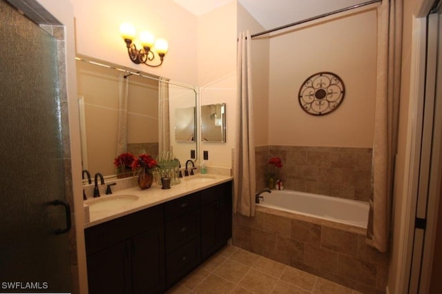 bathroom with vanity, tile patterned floors, and shower with separate bathtub