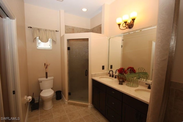 bathroom featuring an enclosed shower, vanity, tile patterned flooring, and toilet