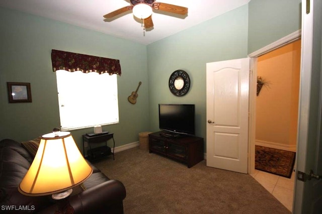 living room with light carpet and ceiling fan