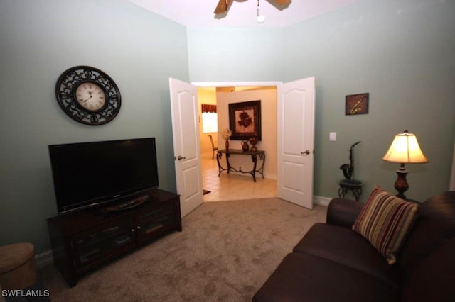 living room with light colored carpet and ceiling fan