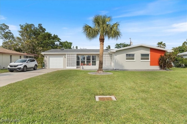 single story home featuring a front lawn and a garage