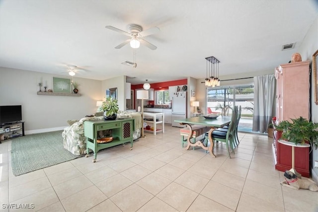 tiled dining room with ceiling fan