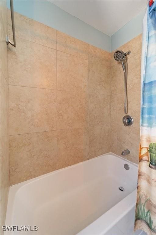 bathroom with shower / bathtub combination with curtain