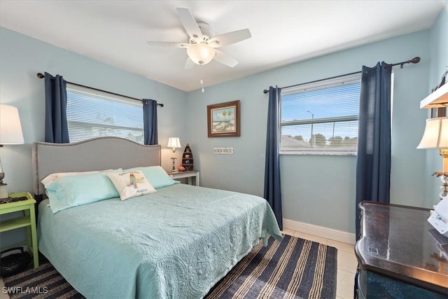 bedroom featuring ceiling fan and light tile patterned flooring